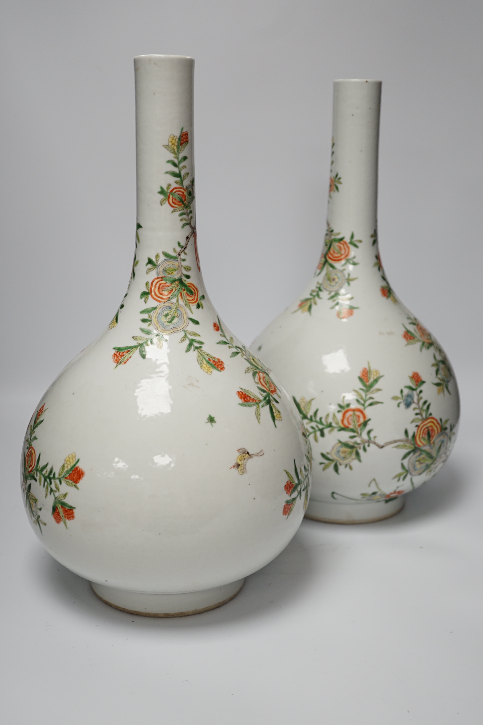 A pair of modern Chinese Kangxi style famille verte bottle vases, 40cm high